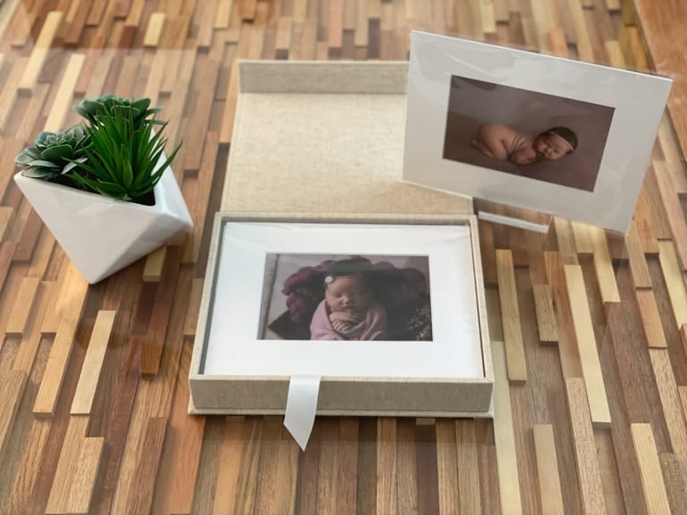 Folio Album in oatmeal colour with example folios of a newborn girl photo shoot