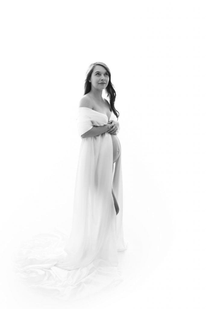 Vancouver Maternity Photographer Pregnant woman posing in white fabric