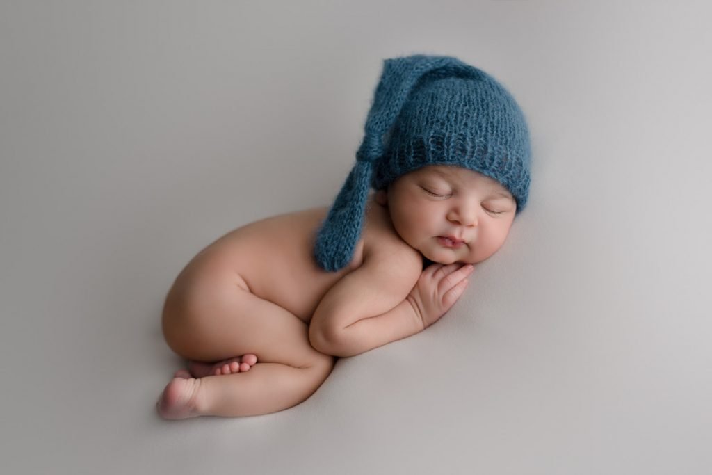 Vancouver Newborn Photo baby boy wearing blue hat