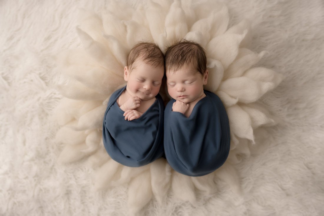 Vancouver Newborn Photographer - twin baby girls sleeping on a felt flower