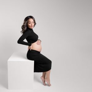 Maternity Photography Vancouver - pregnant woman siting and posing