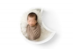 Newborn Photography Vancouver baby sleeping in a white moon bowl
