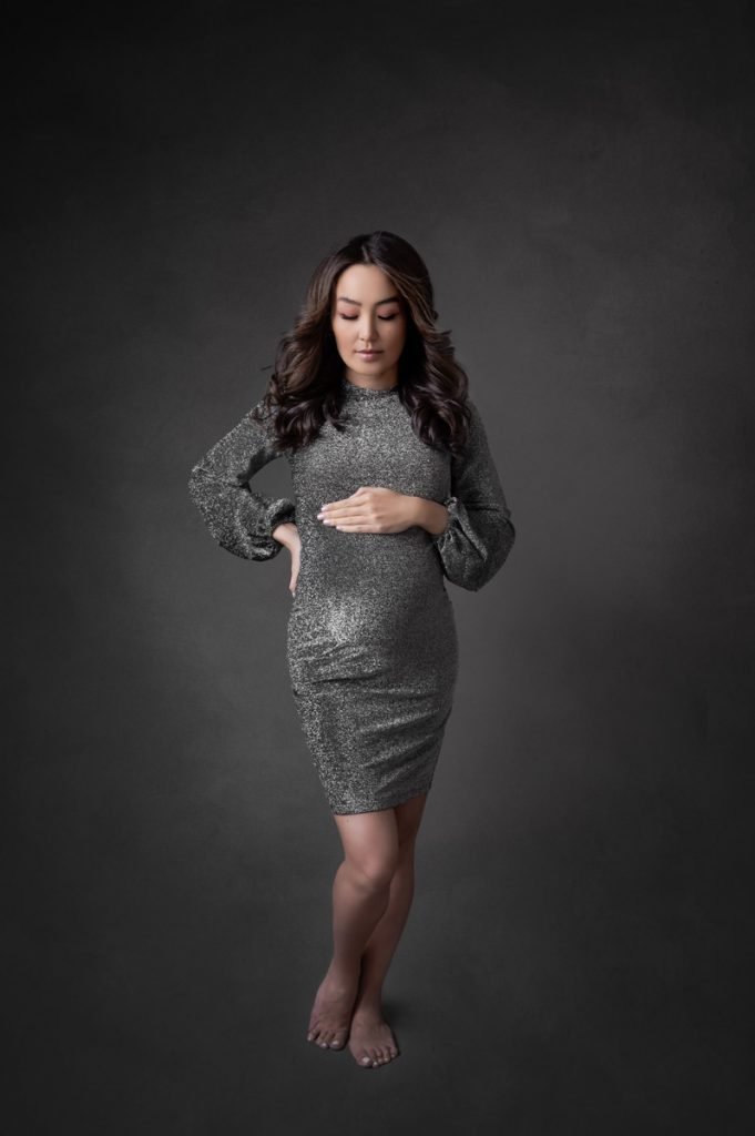 North Vancouver Maternity Photography pregnant woman wearing a silver short dress