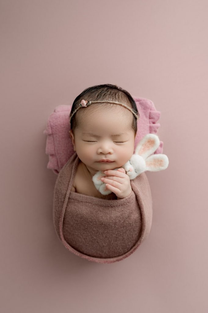 Burnaby Newborn Photography baby girl holding a bunny